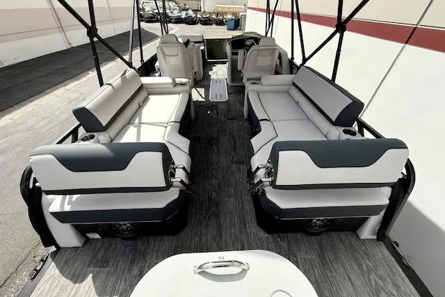 Slide: The Image of 2026 Avalon LSZ Quad Lounge Shift boat interior with spacious seating and modern design. - 11