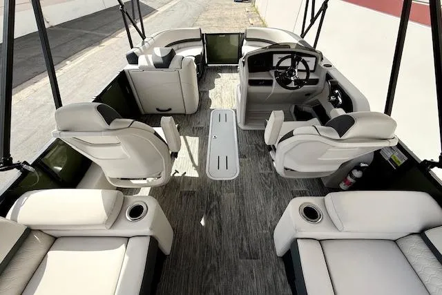 Slide: The Image of 2026 Avalon LSZ Quad Lounge Shift boat interior with luxurious seating and modern helm. - 13