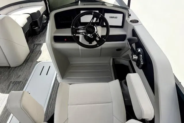 Slide: The Image of 2026 Avalon LSZ Quad Lounge Shift boat interior with modern steering and seating. - 14