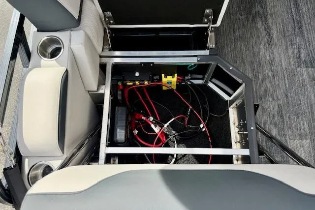 Slide: The Image of Interior view of 2026 Avalon LSZ Quad Lounge Shift boat, showcasing wiring and seating. - 5