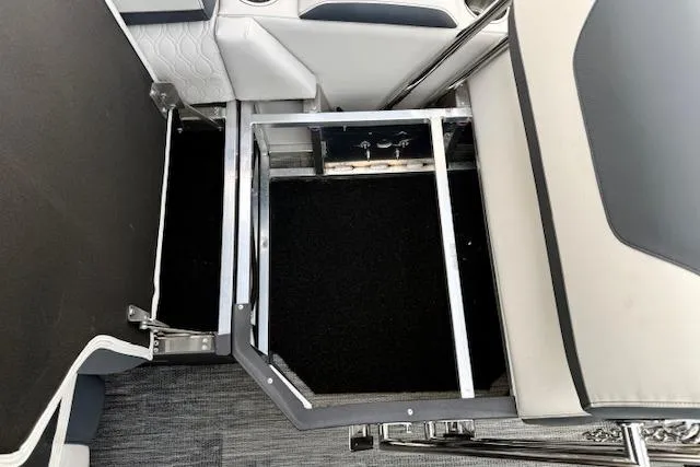 Slide: The Image of 2026 Avalon LSZ Quad Lounge Shift interior storage compartment with sleek seating design. - 7