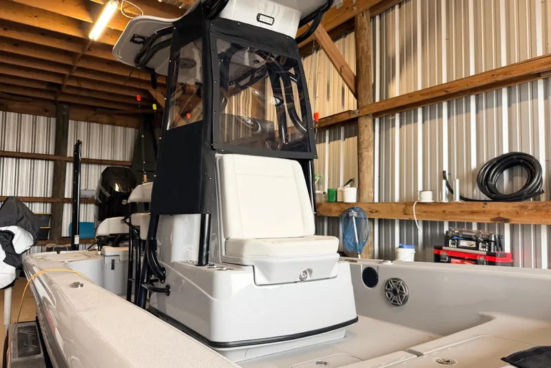 Slide: The Image of 2025 Yellowfin 24 Bay CE boat in a wooden storage shed. - 5