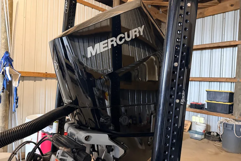 Slide: The Image of Mercury Verado engine on 2025 Yellowfin 24 Bay CE boat in a garage setting. - 8