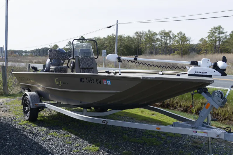 The Image of 2023 G3 Gator Tough 18 CC boat on trailer, equipped with Minn Kota motor. - 1