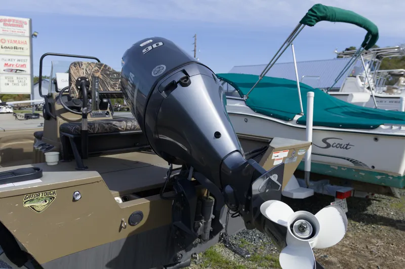 Slide: The Image of 2023 G3 Gator Tough 18 CC boat with powerful outboard motor. - 13