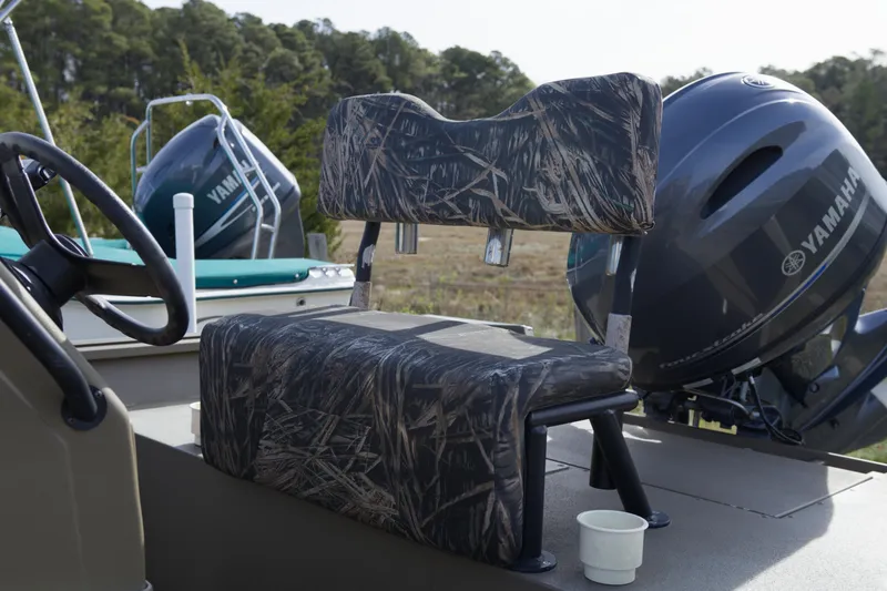 Slide: The Image of 2023 G3 Gator Tough 18 CC boat with camo seating and Yamaha outboard motor. - 5