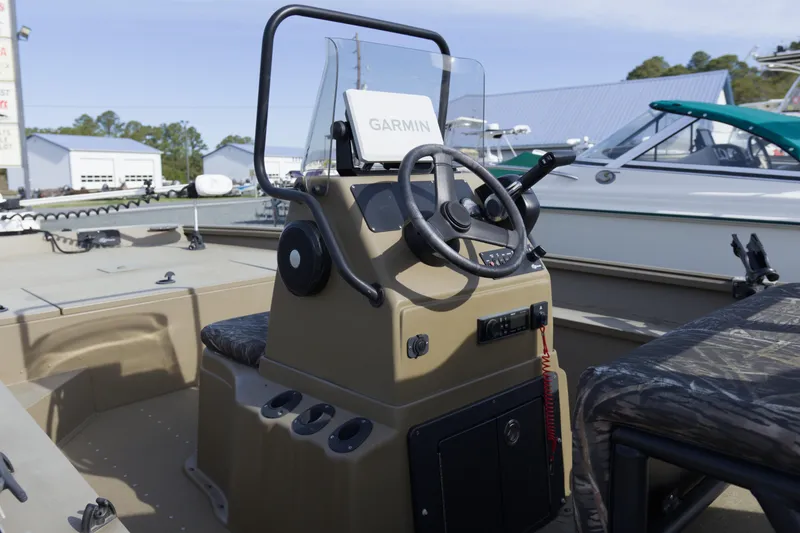 Slide: The Image of 2023 G3 Gator Tough 18 CC boat interior with steering console and Garmin device. - 6
