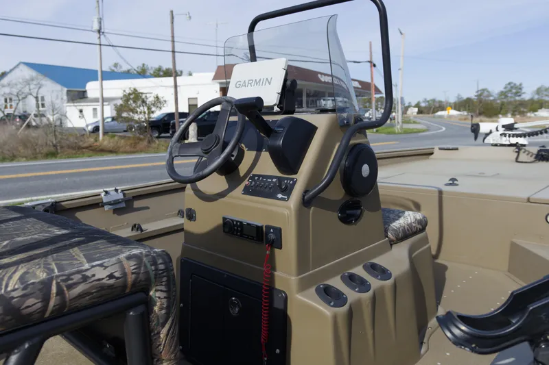 Slide: The Image of 2023 G3 Gator Tough 18 CC boat console with Garmin GPS and camo seating. - 7