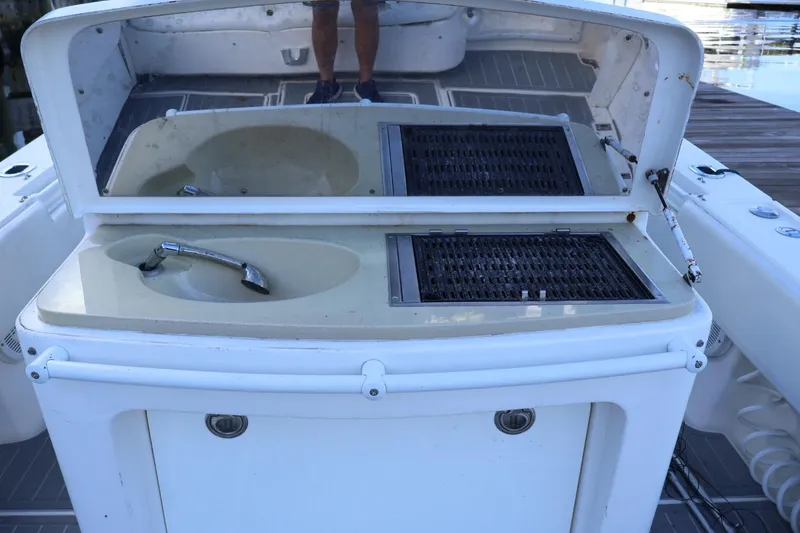 Slide: The Image of 2012 Contender 35 LS boat sink and grill station on deck. - 10