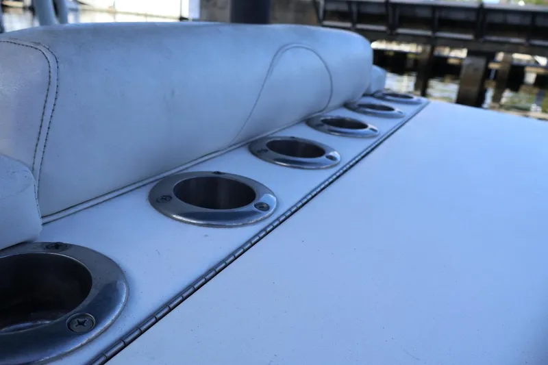 Slide: The Image of 2012 Contender 35 LS boat with rod holders and cushioned seating. - 5