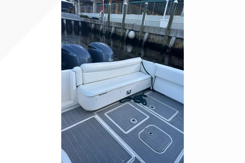 Slide: The Image of 2012 Contender 35 LS boat with twin engines and spacious seating area. - 9