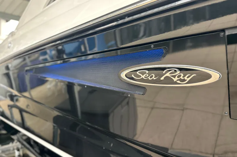 Slide: The Image of 2023 Sea Ray SLX 400 boat with sleek design and logo detail. - 14