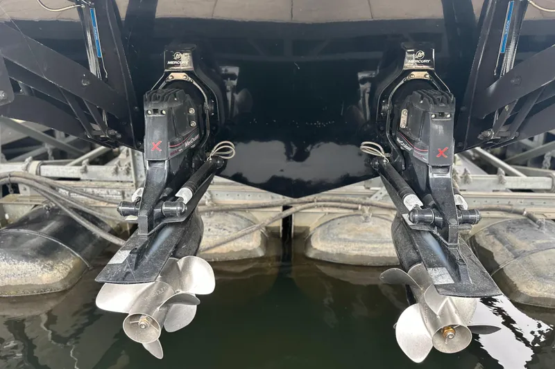 Slide: The Image of 2023 Sea Ray SLX 400 boat with dual Mercury outboard engines in docked position. - 20
