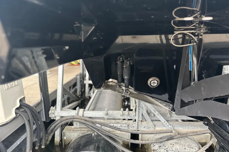 Slide: The Image of 2023 Sea Ray SLX 400 boat hull and mechanical components in dock. - 21