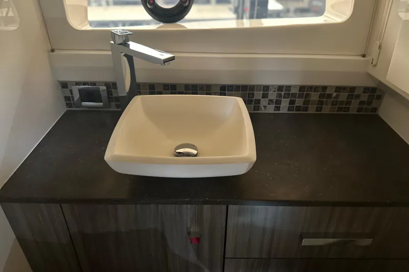 Slide: The Image of Modern bathroom sink in 2023 Sea Ray SLX 400 yacht interior. - 42