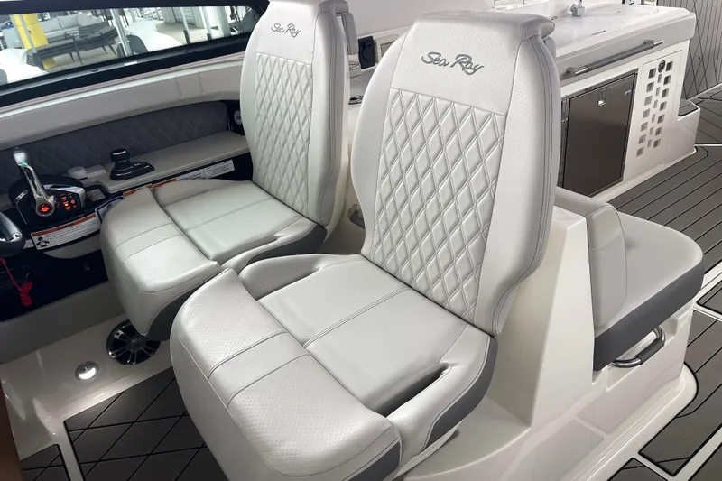 Slide: The Image of 2023 Sea Ray SLX 400 interior with luxurious seating and modern controls. - 43