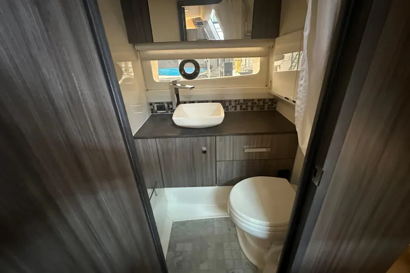 Slide: The Image of Luxurious bathroom interior of 2023 Sea Ray SLX 400 yacht with modern fixtures. - 50