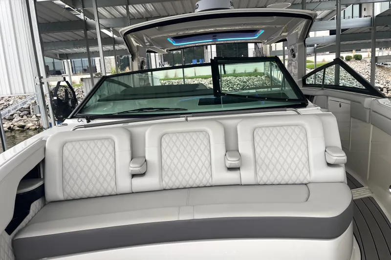 Slide: The Image of 2023 Sea Ray SLX 400 boat interior with luxurious seating and modern design. - 58