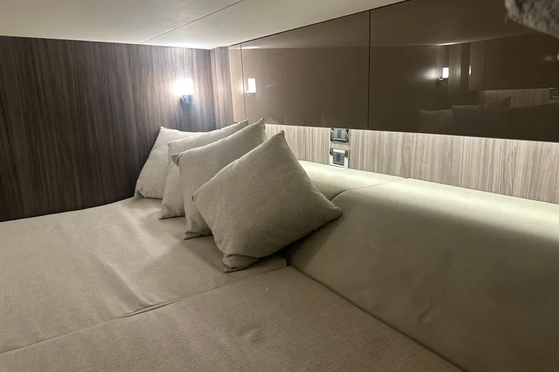 Slide: The Image of Luxurious interior cabin of 2023 Sea Ray SLX 400 yacht with plush bedding. - 62