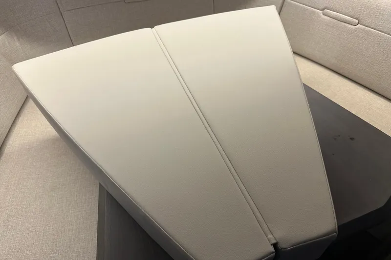 Slide: The Image of Interior seating of 2023 Sea Ray SLX 400 boat, featuring beige upholstery. - 66