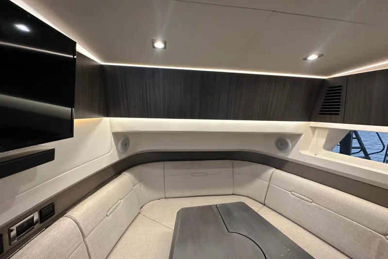 Slide: The Image of Luxurious interior of 2023 Sea Ray SLX 400 yacht with modern seating and lighting. - 68