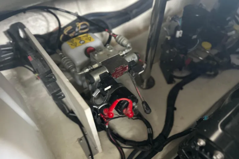 Slide: The Image of Engine compartment of 2023 Sea Ray SLX 400 boat, showcasing mechanical components and wiring. - 70