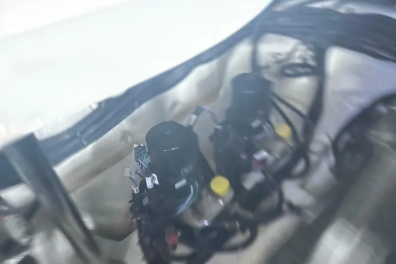 Slide: The Image of Engine components of 2023 Sea Ray SLX 400 boat, featuring wiring and mechanical parts. - 75