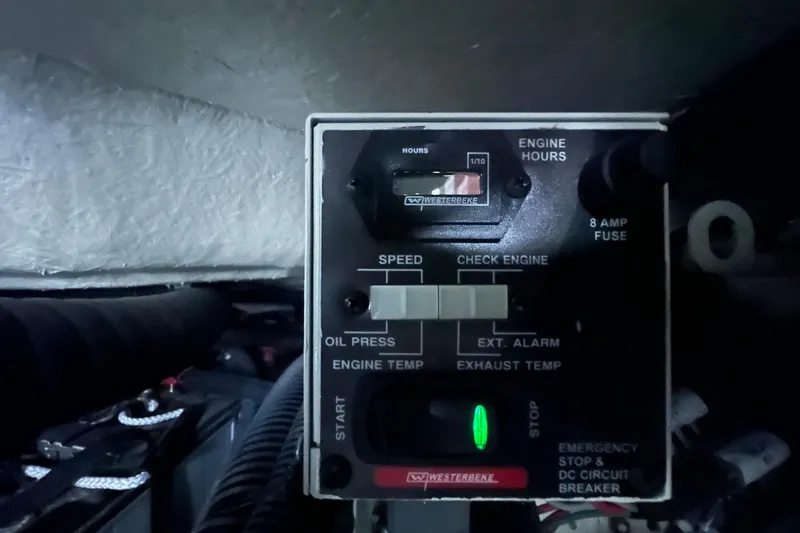 Slide: The Image of Control panel of 2023 Sea Ray SLX 400 boat engine, displaying engine hours and indicators. - 76