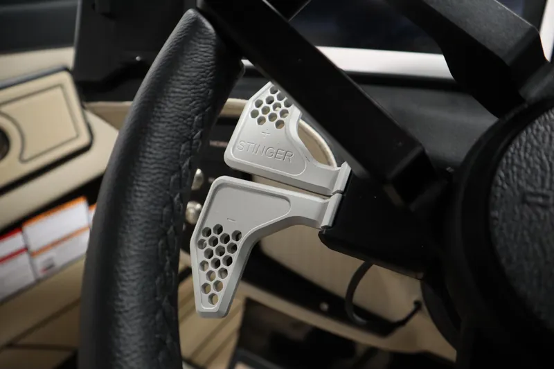 Slide: The Image of 2024 Centurion Ri230 boat interior with modern dashboard and luxurious seating. - 22