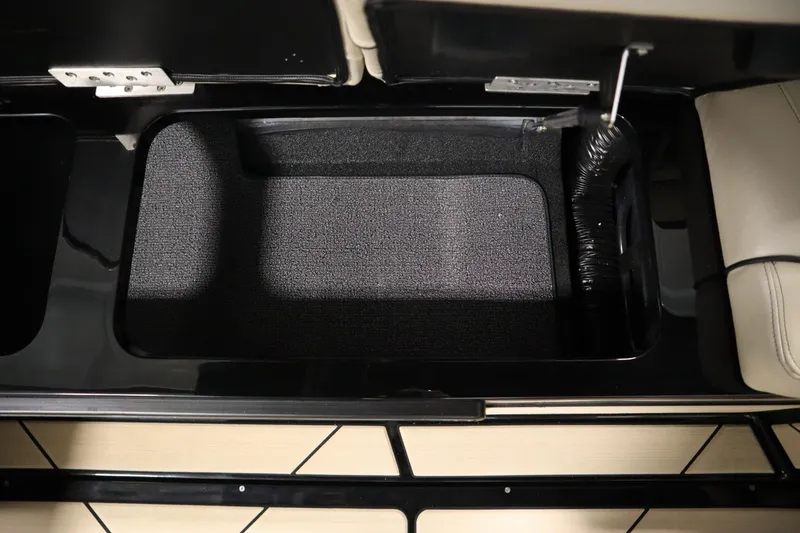 Slide: The Image of 2024 Centurion Ri230 interior with branded storage compartment and cup holders. - 46