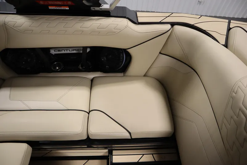Slide: The Image of 2024 Centurion Ri230 interior with beige leather seating and modern design. - 51