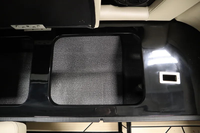 Slide: The Image of 2024 Centurion Ri230 interior storage compartment with black finish and beige accents. - 52