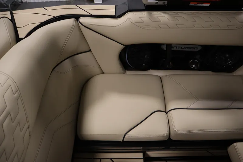 Slide: The Image of 2024 Centurion Ri230 boat interior with sleek flooring and seating details. - 53
