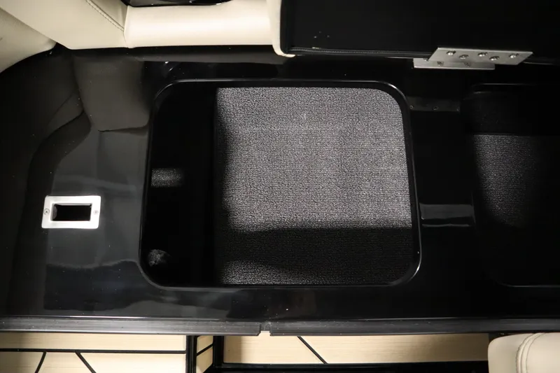 Slide: The Image of 2024 Centurion Ri230 boat interior with beige leather seating and stylish stitching. - 54