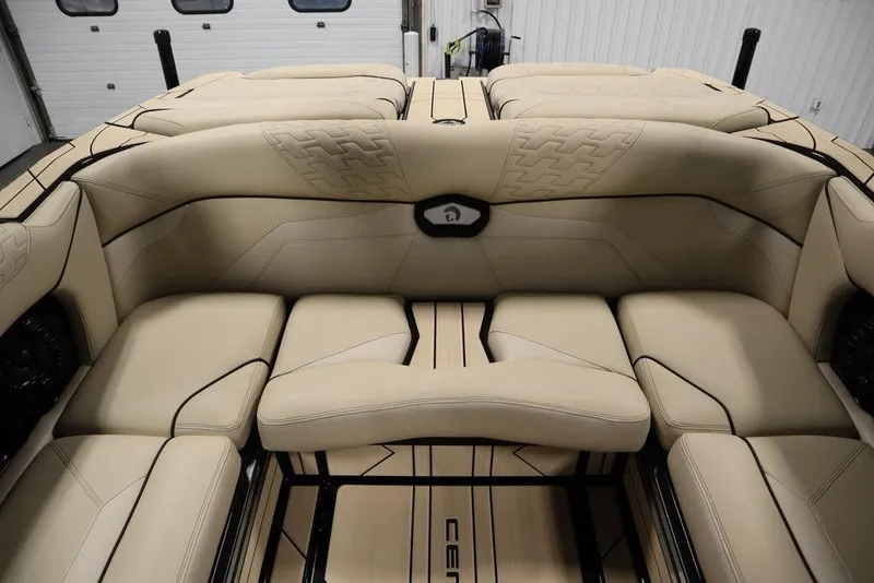 Slide: The Image of 2024 Centurion Ri230 boat interior with beige seating and modern design. - 58