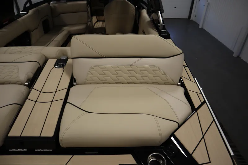 Slide: The Image of 2024 Centurion Ri230 boat accessory in a garage setting. - 65