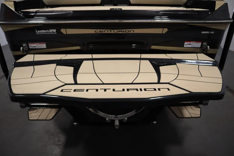 Slide: The Image of 2024 Centurion Ri230 boat interior with beige upholstery and sleek design. - 71
