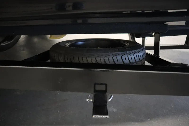 Slide: The Image of 2024 Centurion Ri230 boat interior with beige seating and stylish deck design. - 76