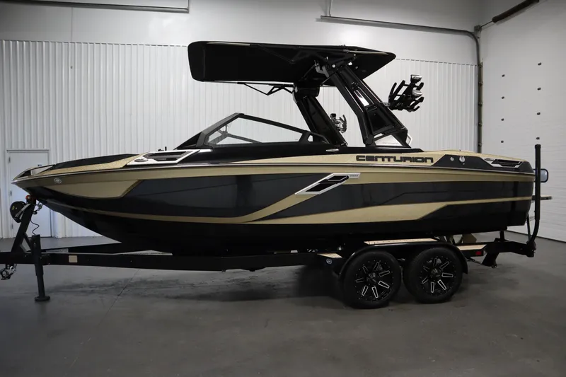 Slide: The Image of 2024 Centurion Ri230 boat in a garage, showcasing sleek design and modern features. - 8