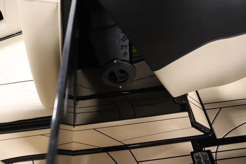 Slide: The Image of 2024 Centurion Ri230 boat propeller and rudder detail in a garage setting. - 80