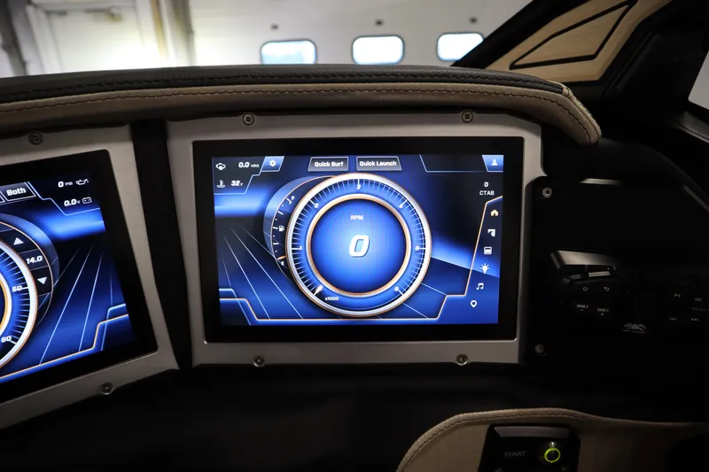 Slide: The Image of Trailer hitch of a 2024 Centurion Ri230 boat in a garage setting. - 83