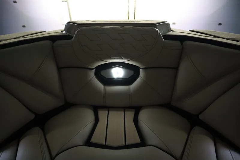 Slide: The Image of Luxurious interior of 2024 Centurion Ri230 boat with ambient lighting and plush seating. - 88