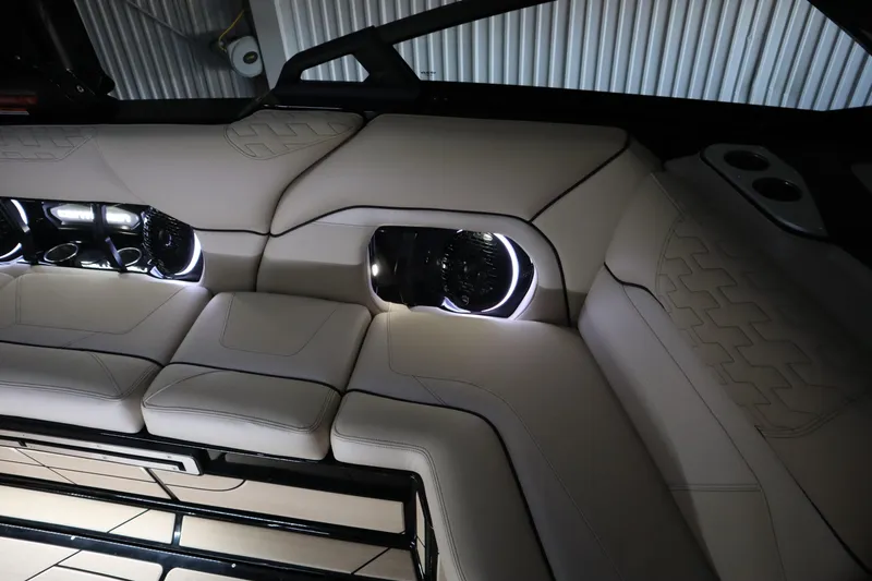 Slide: The Image of 2024 Centurion Ri230 boat cockpit with dual screens and Gussi Italia steering wheel. - 92