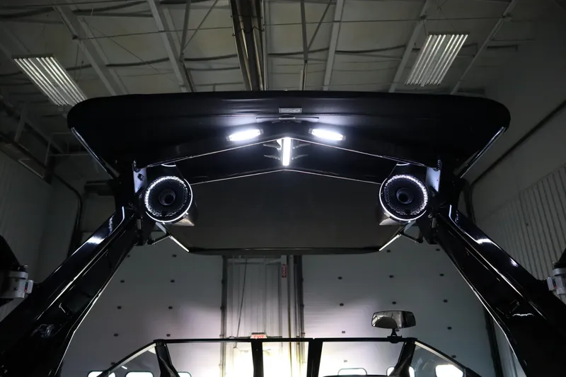 Slide: The Image of Luxurious interior of 2024 Centurion Ri230 boat with ambient lighting and spacious seating. - 97