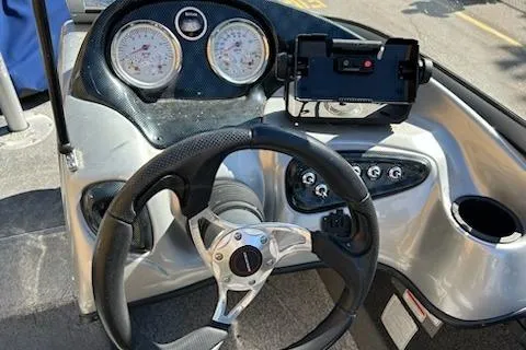 Slide: The Image of Steering console of 2012 Tracker Targa V-18 WT boat with gauges and controls. - 11