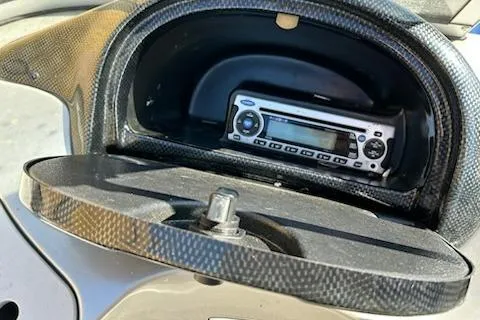 Slide: The Image of 2012 Tracker Targa V-18 WT dashboard with built-in stereo system. - 14