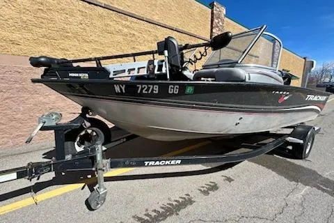 Slide: The Image of 2012 Tracker Targa V-18 WT boat on trailer, parked outdoors. - 4