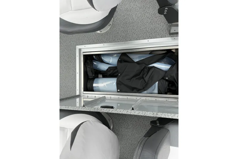 Slide: The Image of Storage compartment in 2026 Smoker Craft Osprey 172 boat, featuring organized interior space. - 12