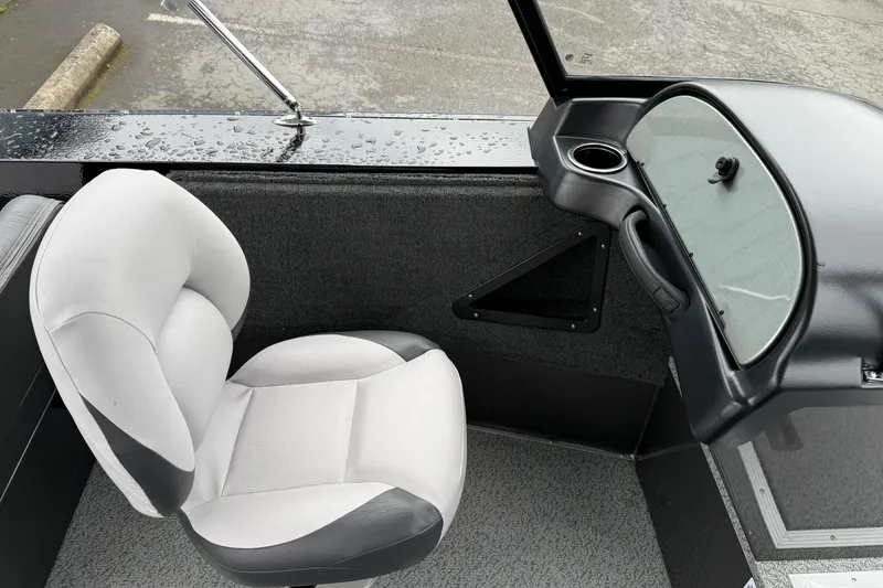 Slide: The Image of 2026 Smoker Craft Osprey 172 boat interior with white seat and sleek dashboard. - 14
