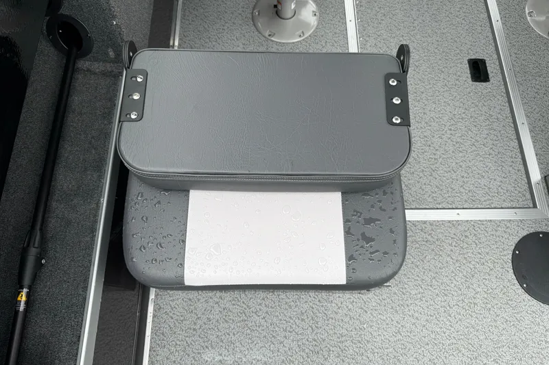Slide: The Image of Gray seat with water droplets on a 2026 Smoker Craft Osprey 172 boat interior. - 15